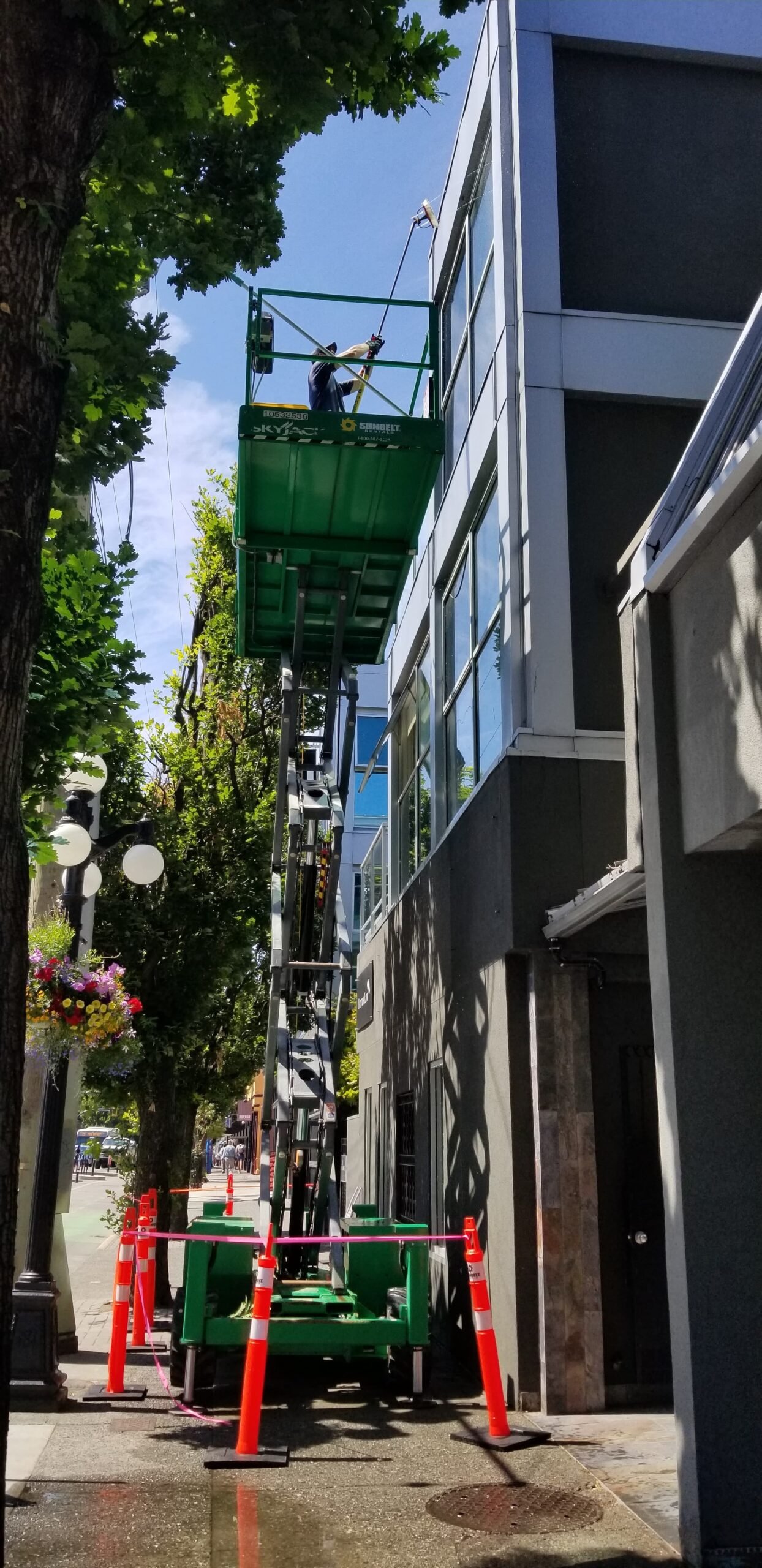 Window clean using a scissor lift